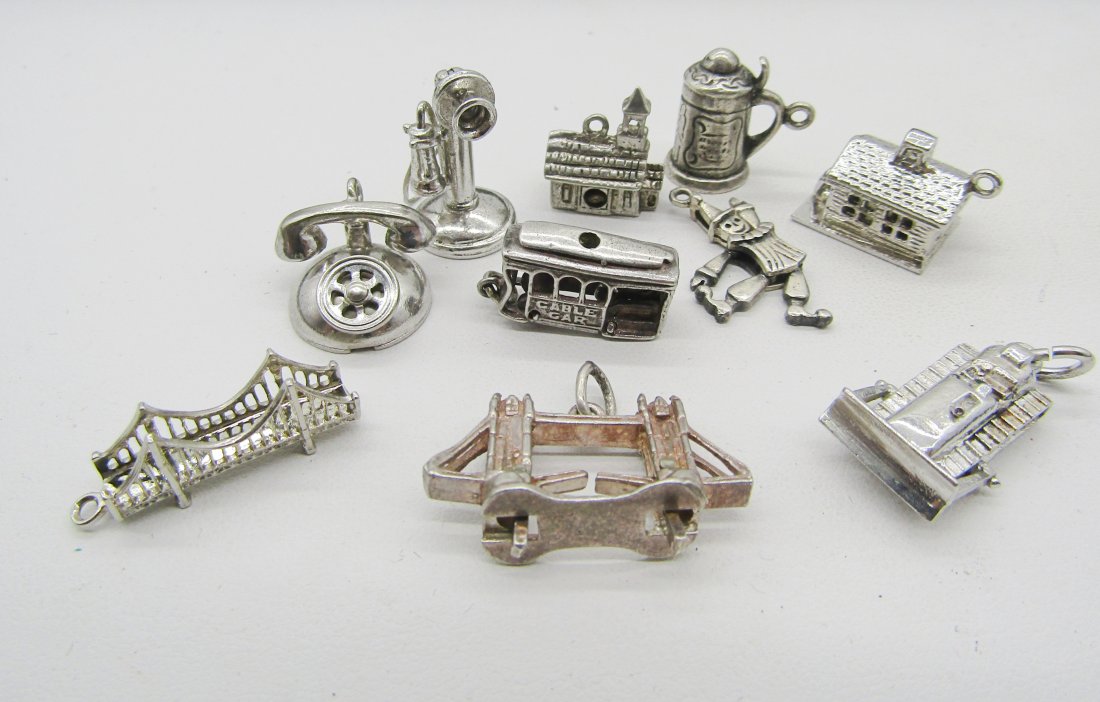 10 vintage sterling charms for charm bracelets: 10 vintage sterling charms to include telephones, London Bridge, tractor, etc.