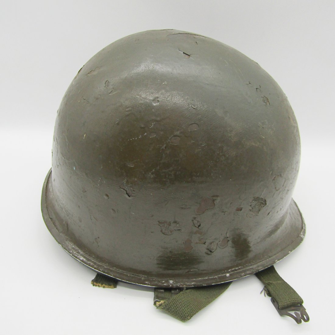 early U.S. Military metal helmet with liner, chin strap: vintage U.S. metal military helmet, liner and chin strap. unknown age.