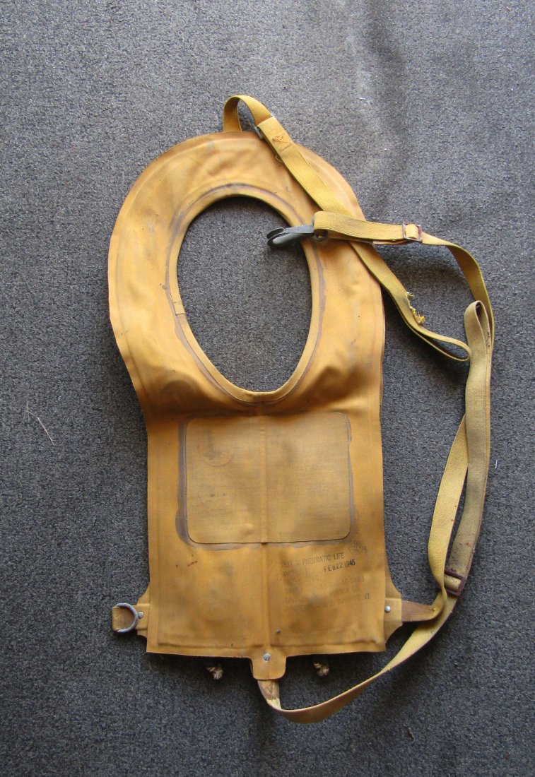 2nd WWII period Pneumatic "Mae West" Life vest 1945: WWII period, circa 1945 Pneumatic life vest 2 draw strings. with die marker.