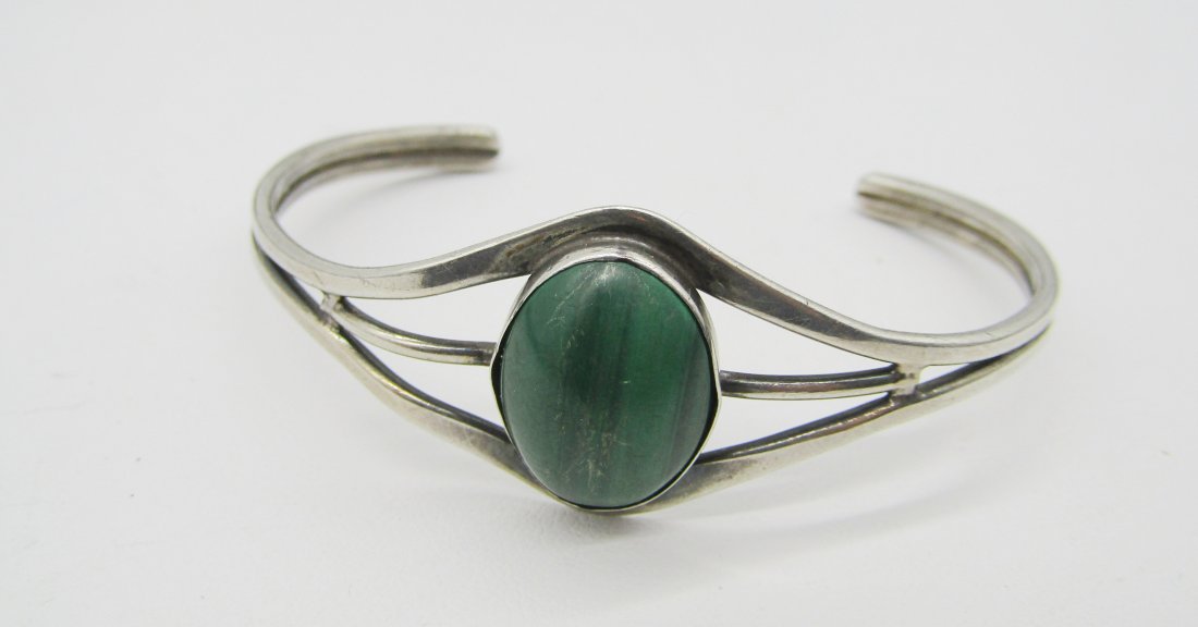 vintage Sterling and Malachite Cuff bracelet, signed: vintage sterling cuff bracelet with oval malachite stone. signed T. weighs 13 grams.