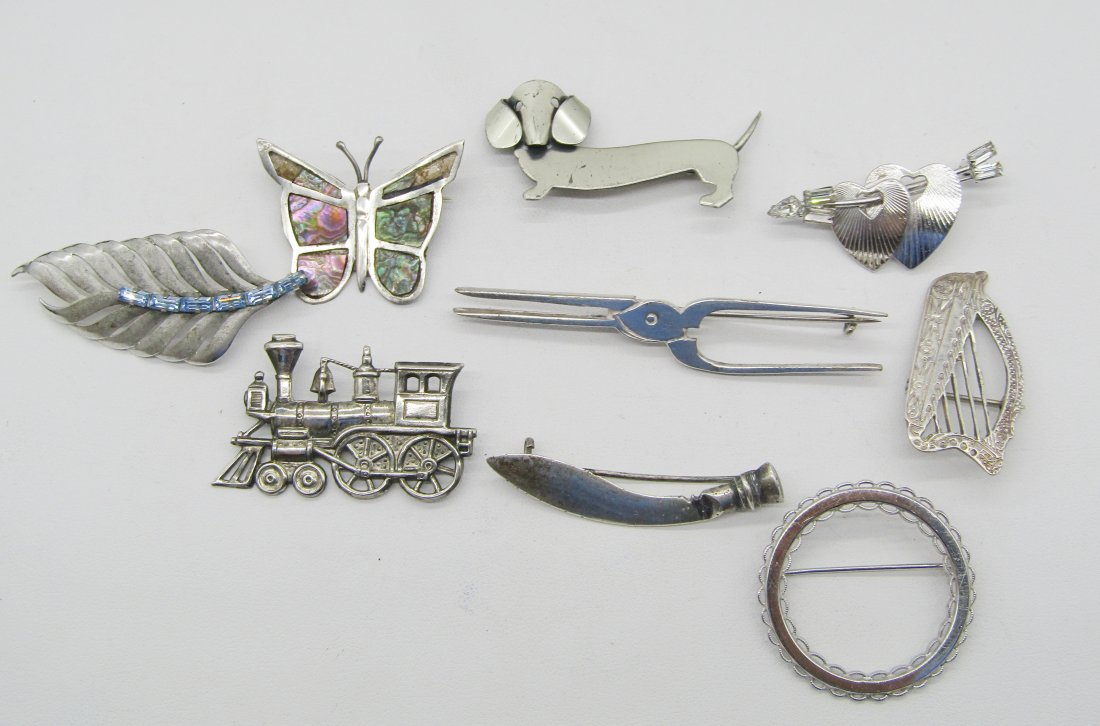 lot of vintage sterling pins: estate lot of sterling pins. Beau Dog, train, harp, curling iron, etc. 40.7 grams.