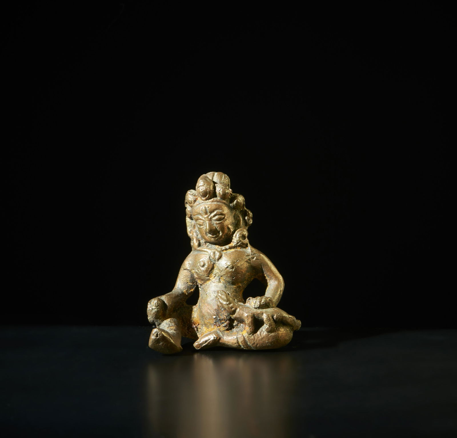 Small bronze figure of Jambhala  Nepal, early 20th century  Measurements: h. 5.5 X l. 4.7 cm (1 of 3)
