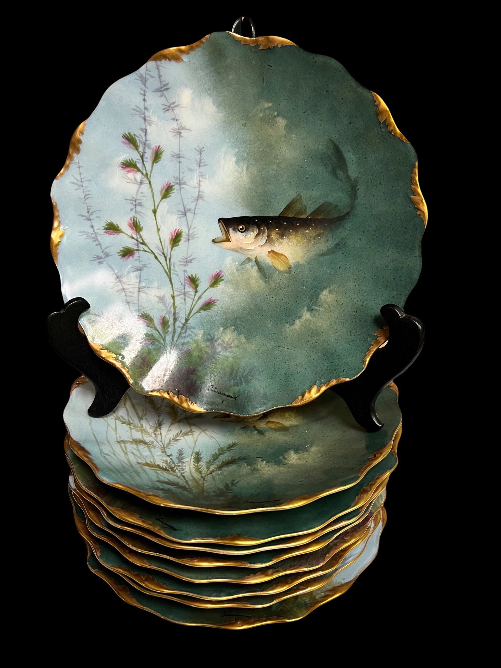 Set of 9 Ovington Bros Limoges Fish Plates: Set of 9 Ovington Bros Limoges Fish Plates Scallop design with gold trim Each plate has slightly different design Diameter of plate 9" Each plate signed Senamaud Condition of plates good
