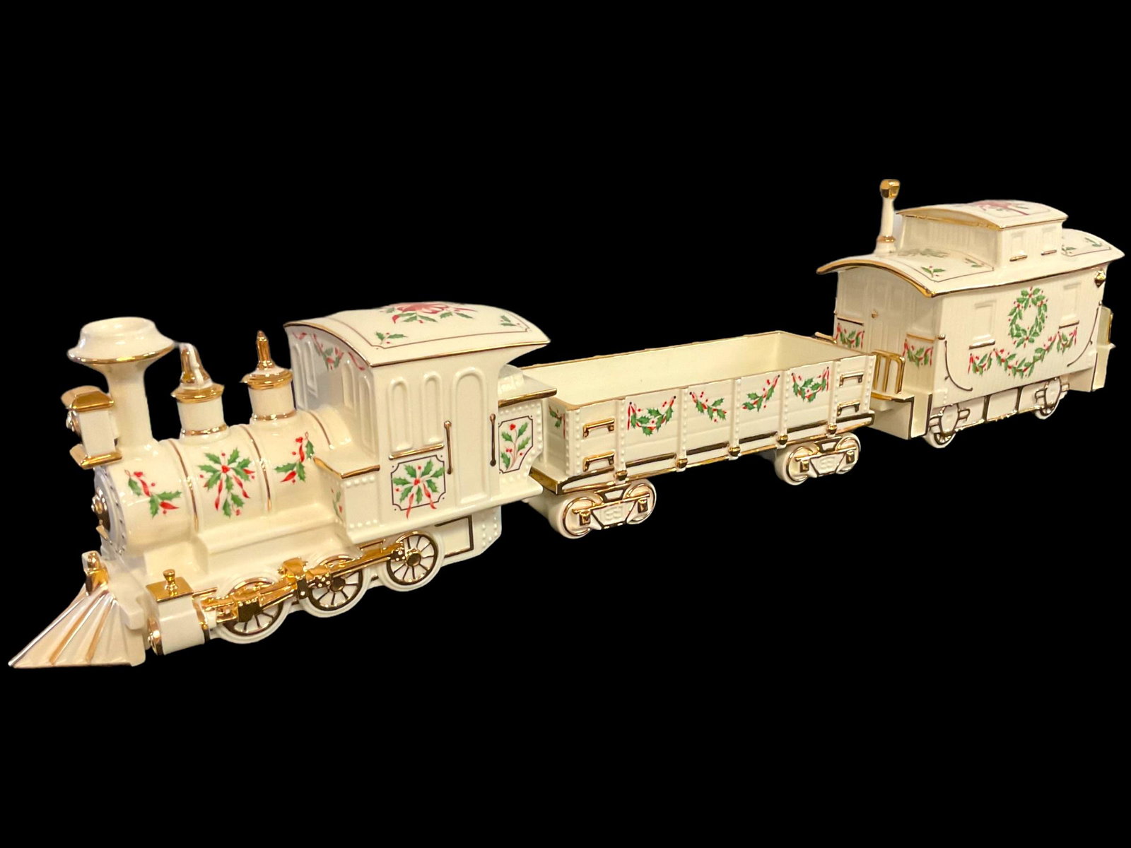 Lenox Holiday Christmas Junction Engine Caboose and Wagon Centerpiece Train Set with boxes: Lenox Holiday Christmas Junction Engine Caboose and Wagon Centerpiece Train Set, Lenox Holiday Train Set decorated with Holly and Berries trimmed in Gold, Engine approximately 11 1/2" L, 7" H, 4 1/2" 