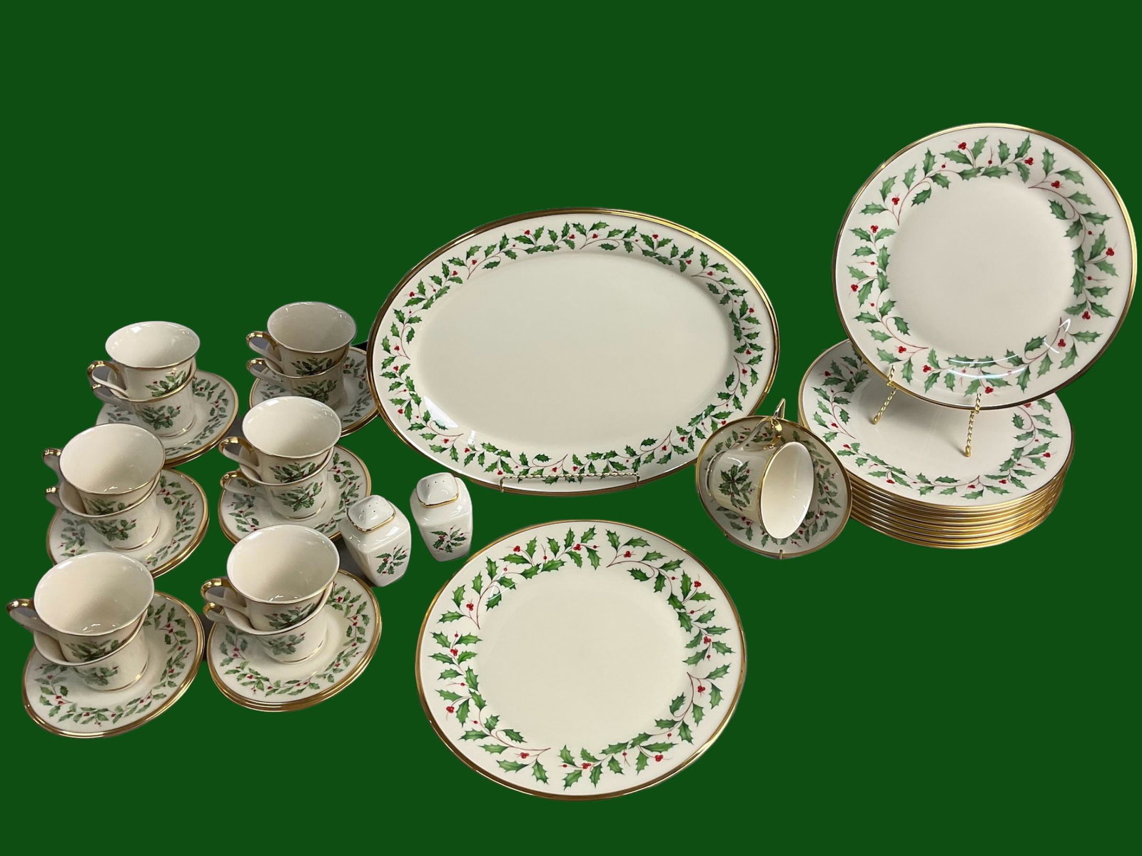 Lenox Holiday China with Gold Trim Holly and Berries Design 41 Pieces: Lenox Holiday China with Gold Trim Holly and Berries Design 41 Pieces, Includes: 12 Dinner Plates, 13 Cups and Saucers, 1 Oval Platter, 16 1/4" L, 1 Charger, 11 1/2" diameter, Salt and Pepper, Conditi