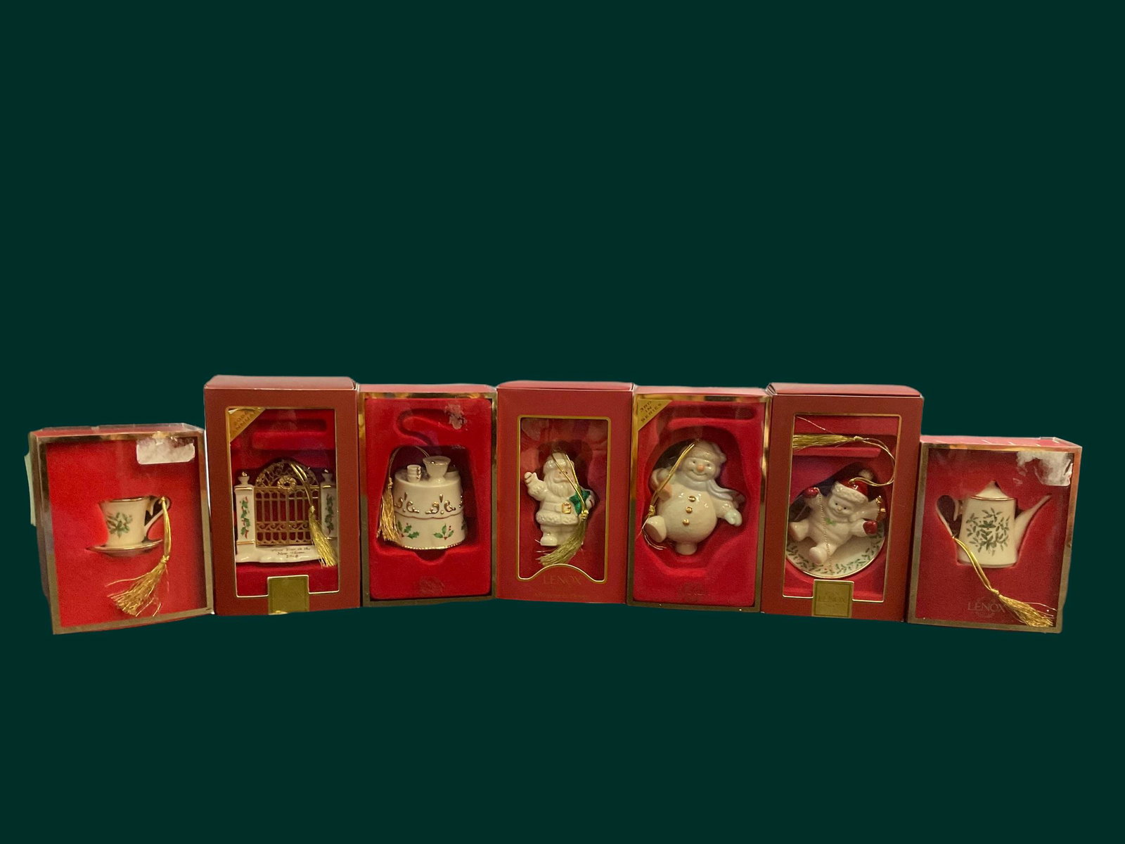 Group of 7 Lenox Ornaments with Boxes: Group of 7 Lenox Ornaments with Boxes, Ornaments include: 2006 First Year In New Home, Holiday Teapot, Holiday Cup and Saucer, Holiday Home Table, Snowman Toting Tree, Santa with Star, Snowman Saucer,