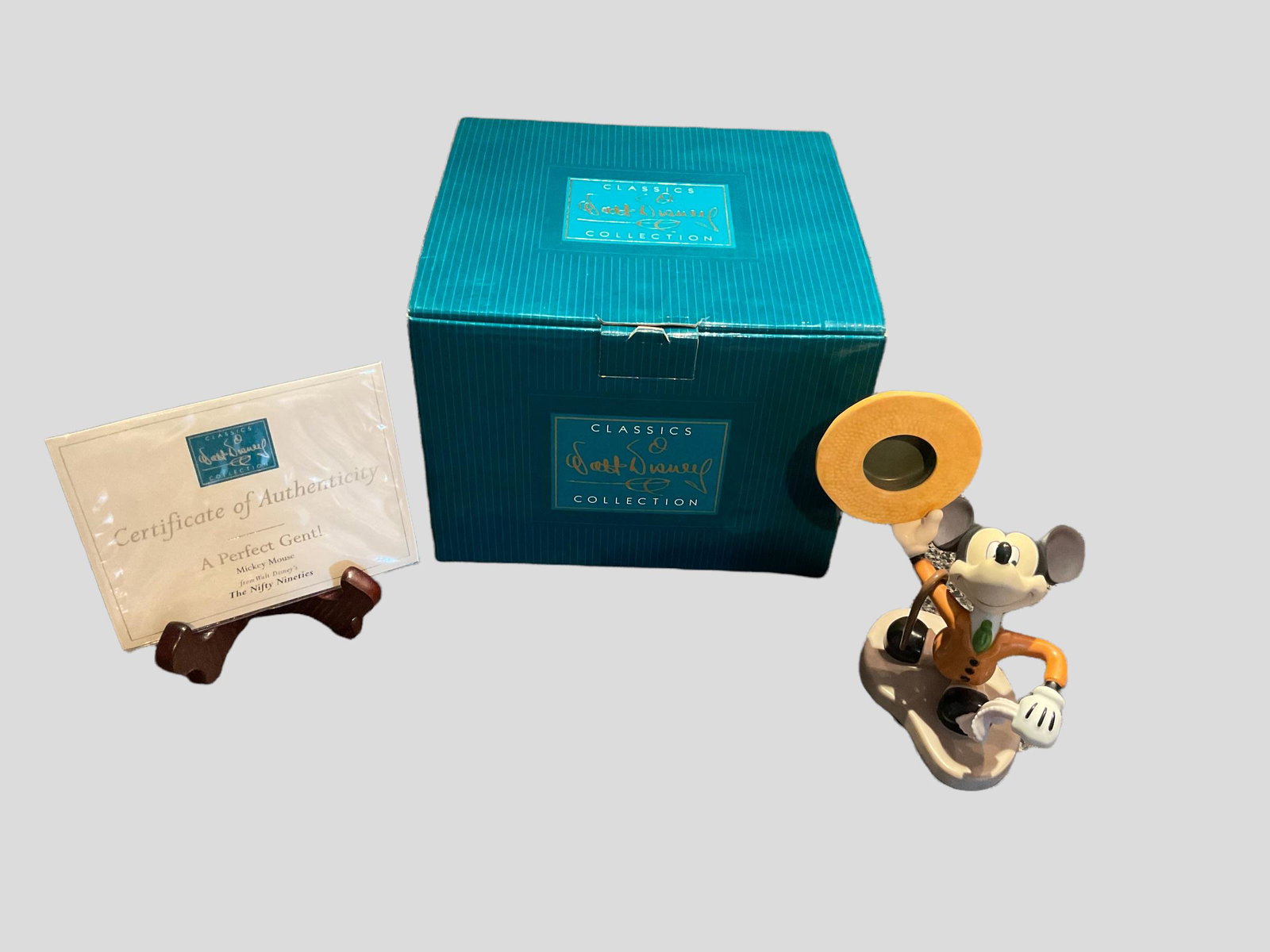 Walt Disney Classics Collection Mickey Mouse A Perfect Gent! From The Nifty Nineties with COA and: Walt Disney Classics Collection Mickey Mouse A Perfect Gent! From The Nifty Nineties with COA and box, Measure 5"W x 6 1/2" H x 4 1/2" D, Condition very good, see photographs