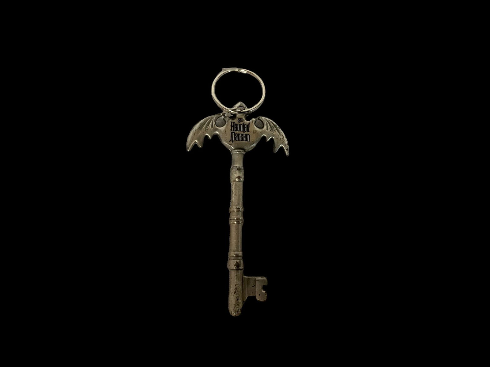 Disney Haunted Mansion Skeleton Keychain: Disney Haunted Mansion Skeleton Keychain, Approximately 4 1/2”L, Condition shows wear on key, see photographs