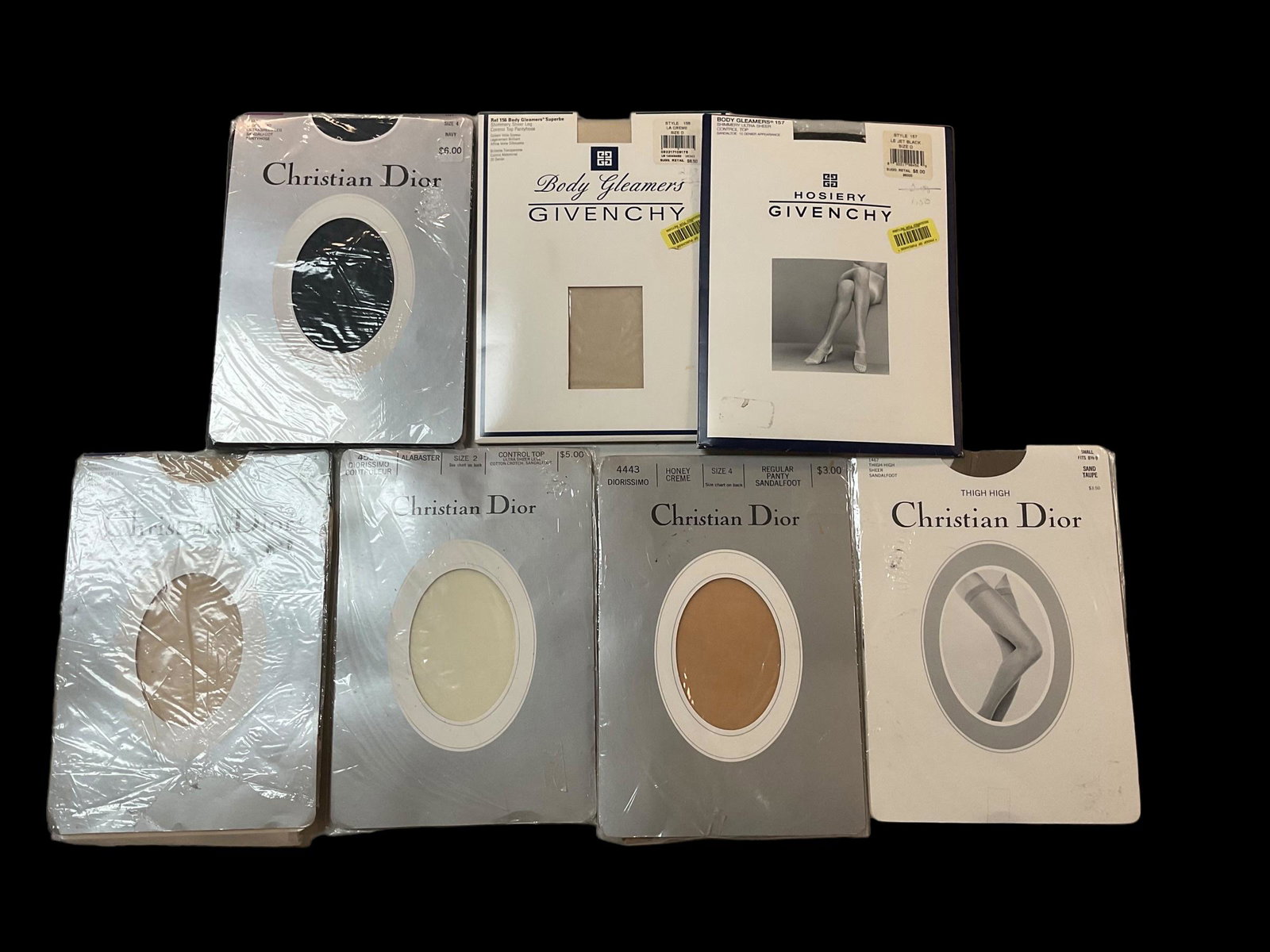 Collection of 7 Christian Dior and Givenchy Vintage Hosiery: Collection of 7 Christian Dior and Givenchy Vintage Hosiery, 4 Pairs of Christian Dior pantyhose in various sizes and colors, 1 pair Christian Dior thigh highs, 2 pairs of Givenchy pantyhose in variou