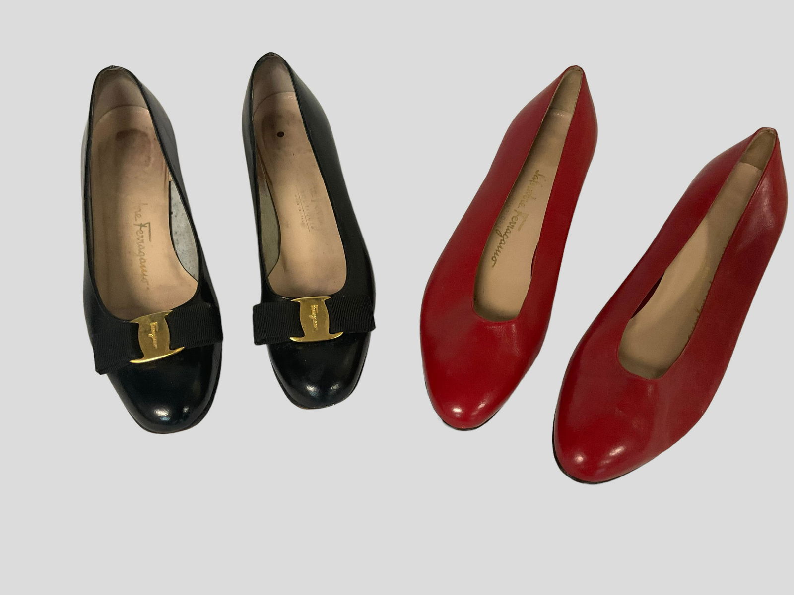 Pair of Salvatore Ferragamo Vintage Shoes: Pair of Salvatore Ferragamo Vintage Shoes, Plain red Ferragamo size 8 1/2 B, Black with gold buckle size 7 AA, Condition both pairs of shoes heels need to be replaced, see photographs