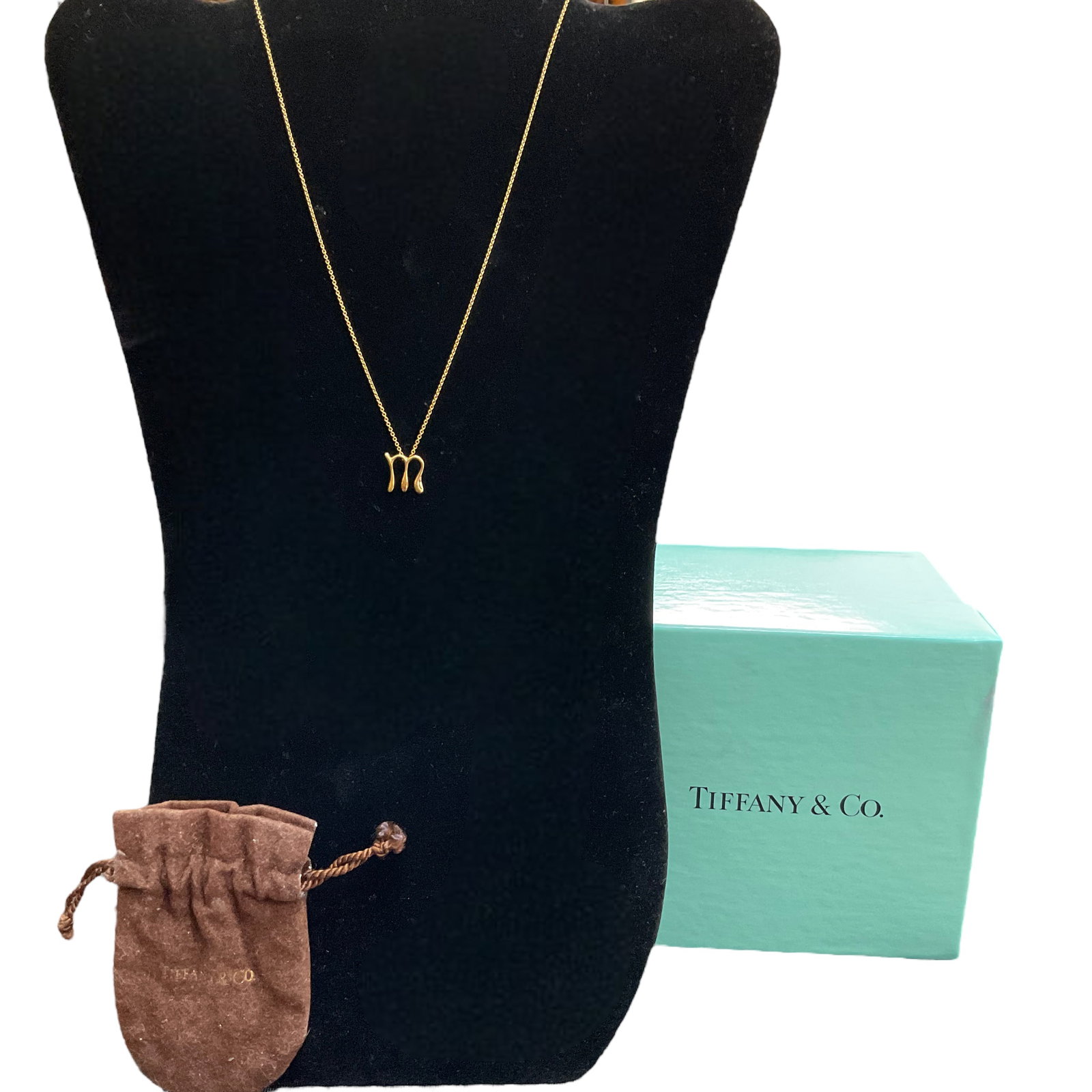 Tiffany & Co., Elsa Peretti "M" Alphabet Pendant & Chain Necklace in 18 kt Yellow Gold: Tiffany & Co., Elsa Peretti "M" Alphabet Pendant & Chain Necklace in 18 kt Yellow Gold. Item is Used, Good Condition. See Photographs. 16" Chain Weight 3.2 g
