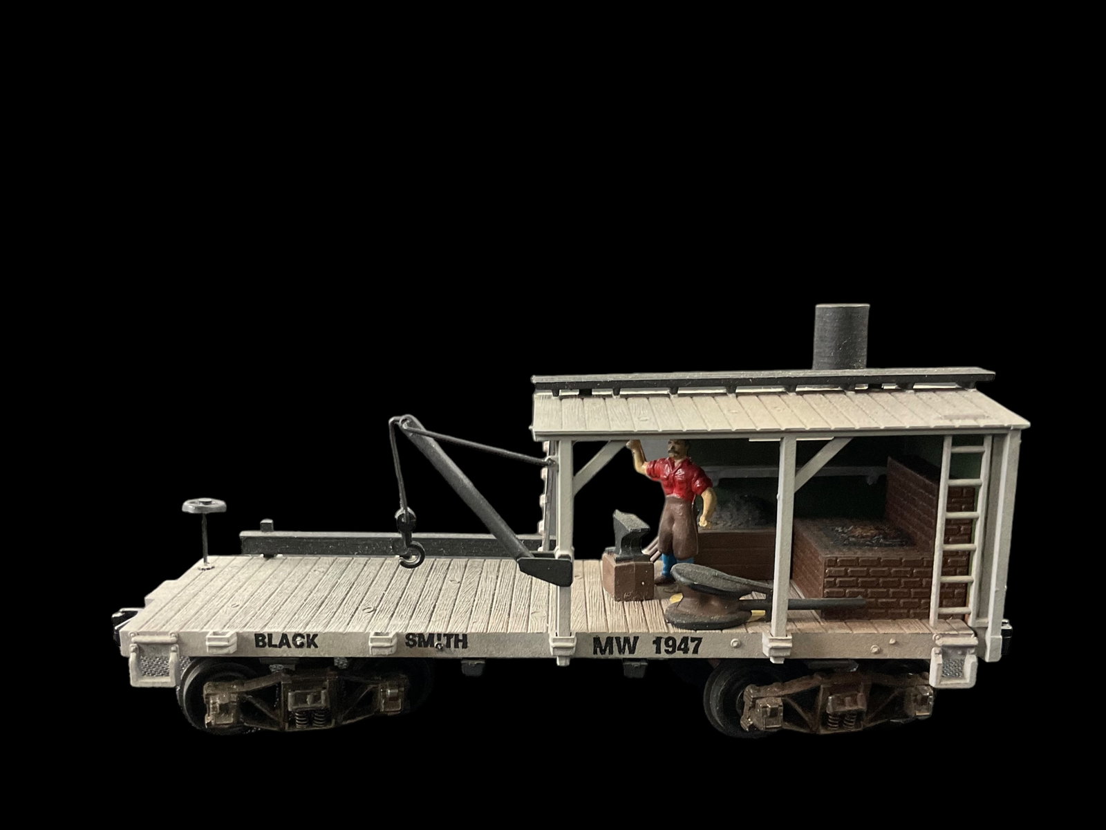 HO Blacksmith Shop 8-Wheel Train Car MW1947: HO Blacksmith Shop 8-Wheel Train Car MW1947, Measures 2" H x 4 1/2" L x 1 1/4" W, Condition, shows corrosion on bottom, see photographs.