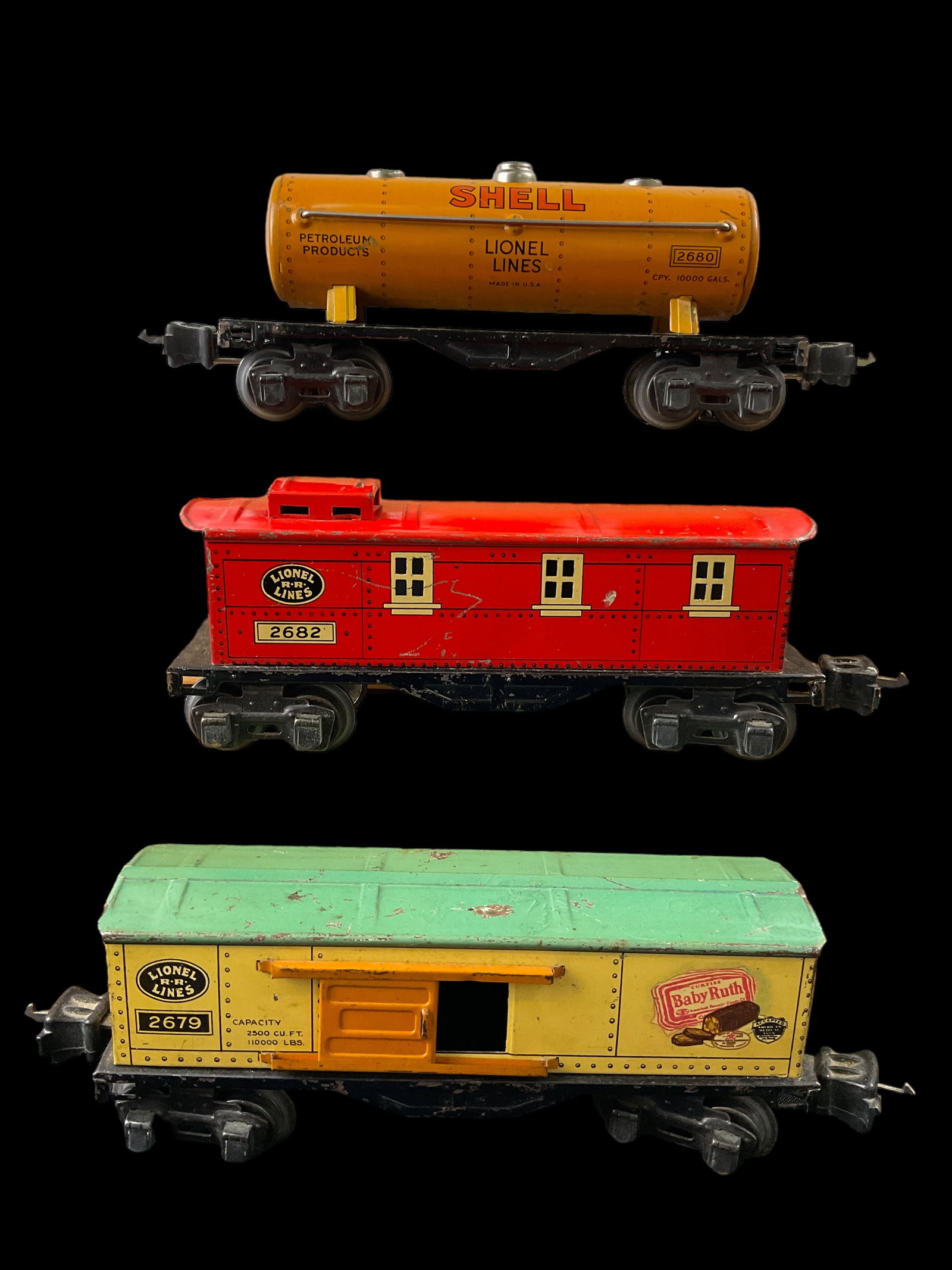 Group of 3 Lionel Prewar O Gauge 2679 Baby Ruth Box Car 2680 Shell Tank Car 2682 Box Car: Group of 3 Lionel Prewar O Gauge 2679 Baby Ruth Box Car 2680 Shell Tank Car 2682 Box Car, Condition, see photographs. 