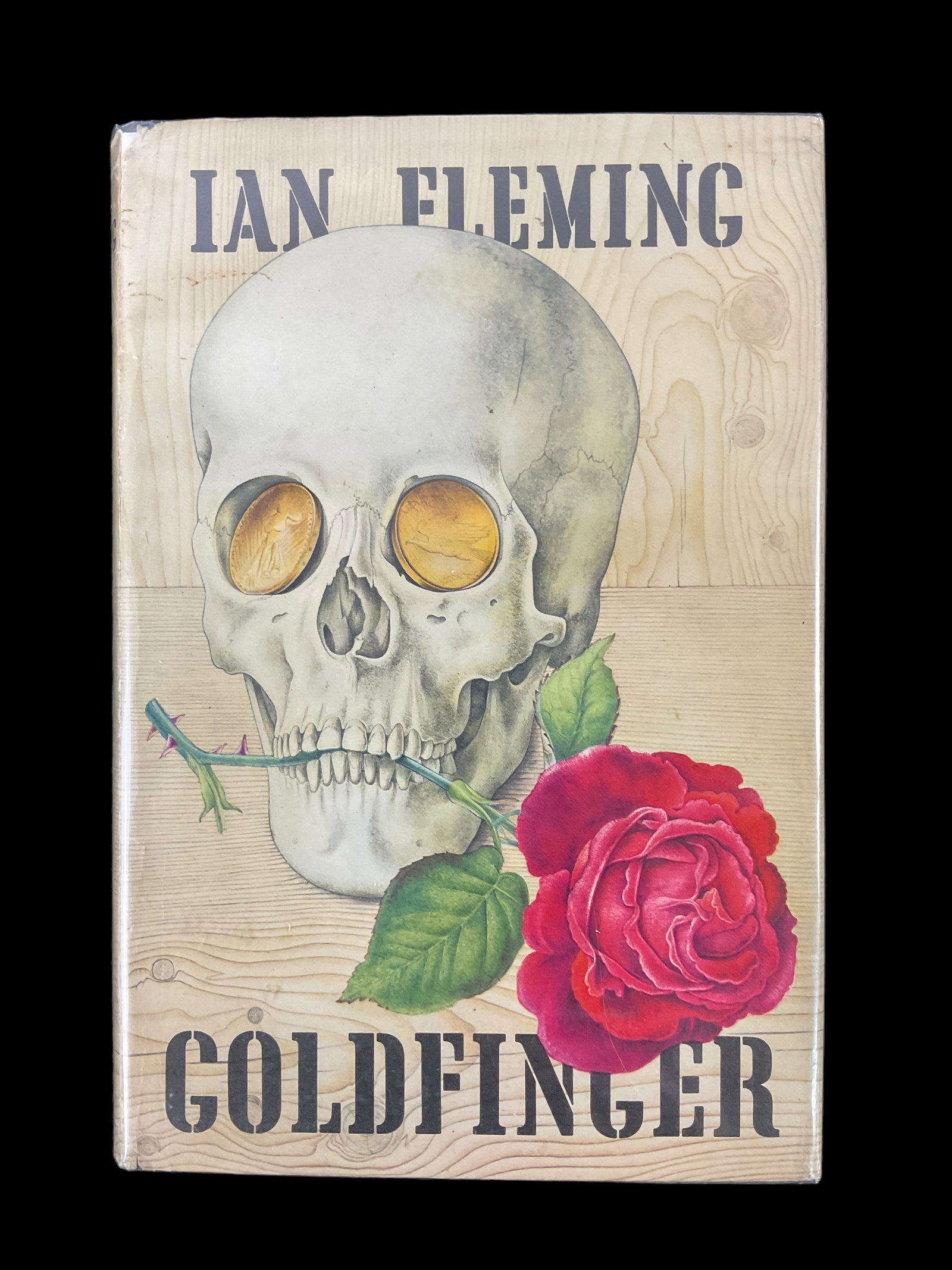 Ian Fleming Goldfinger MacMillan Company 1959 James Bond: Ian Fleming, Goldfinger MacMillan Company, New York, 1959. First Published 1959, Printed in Great Britain, Black Boards with embossed skull design, in original pictorial dust jacket designe