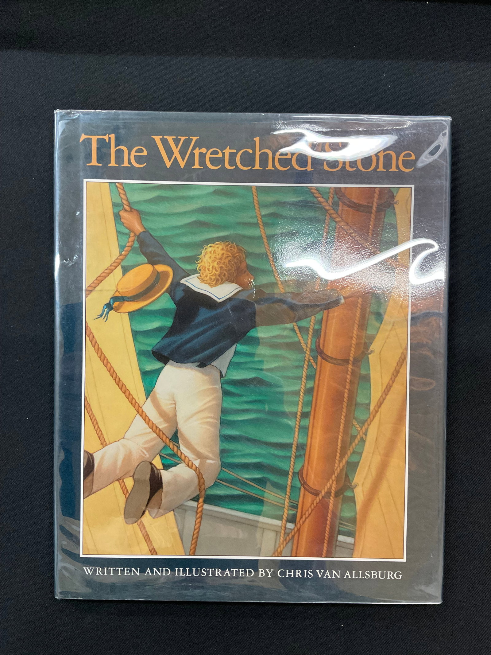 The Wretched Stone by Chris Van Allsburg 1st Edition 1991: The Wretched Stone by Chris Van Allsburg 1st Edition 1991 Houghton Mifflin Company, Illustrated by the Author, ISBN: 0395533074, Numbered Edition Dust Jacket and Mylar Cover Condition book bumped corn