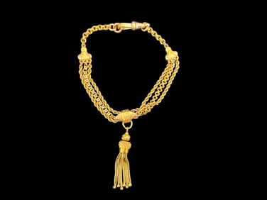 A 9 CT Tassel Bracelet by Charles Daniel Broughton.