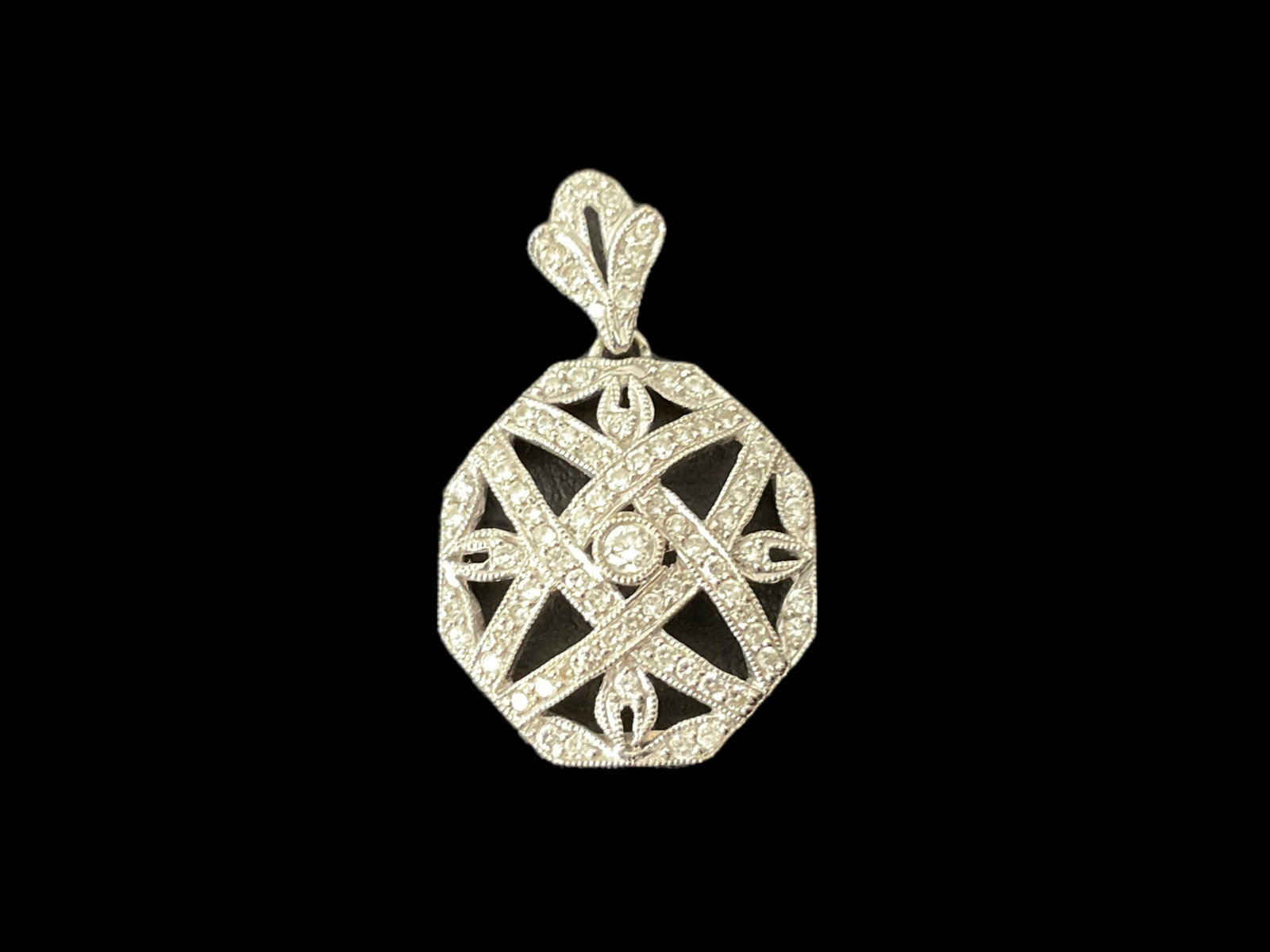 18K White Gold and Diamond Pendant: 18K White Gold and Diamond Pendant. The pendant and bail have a total of 82 diamonds, bail has 11, pendant has 71. The pendant is stamped 18K 750 illegible makers mark., 17.49 mm W x 27.46 mm Tall inc