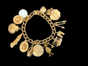 14K Yellow Gold Charm Bracelet with 16 Suspended Charms.