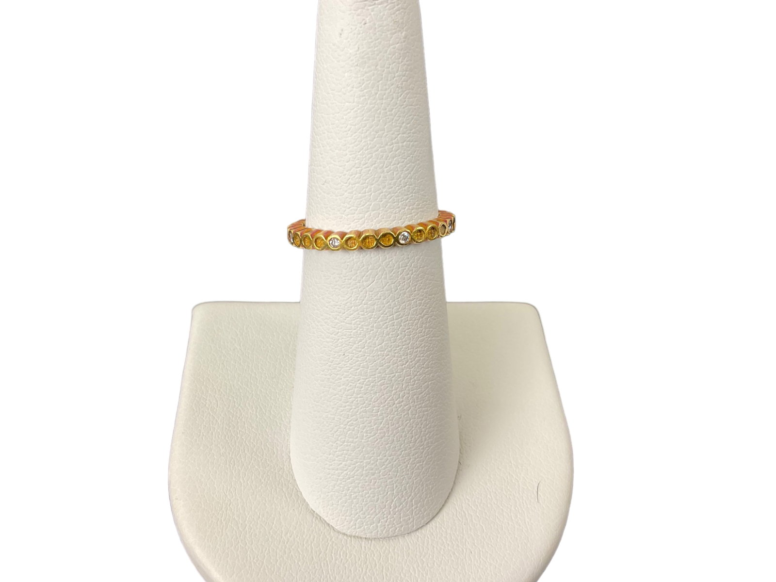18K Gold and Diamond Band by Hidalgo: 18K Gold and Diamond Band by Hidalgo. The ring contains 8 small round diamonds. The ring is stamped 750, Hidalgo and is a size 6.25. Total Weight: 2.9 grams Condition: Good, See Photographs.