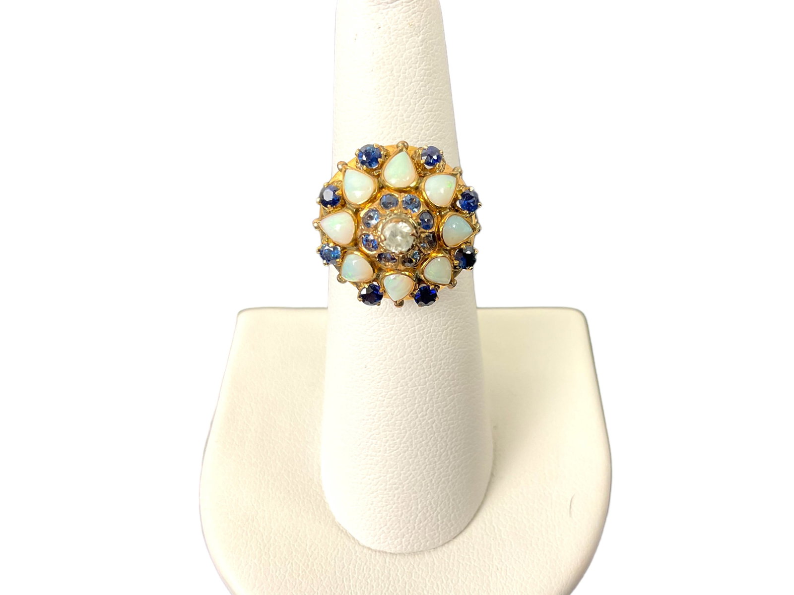 18K Yellow Gold Sapphire, Opal and Diamond Parasol Ring: 18K Yellow Gold Sapphire, Opal and Diamond Parasol Ring. The ring contains 8 round sapphires measuring approximately 2.54mm, 8 round sapphires measuring approximately 1.7mm, 8 teardrop opals measuring
