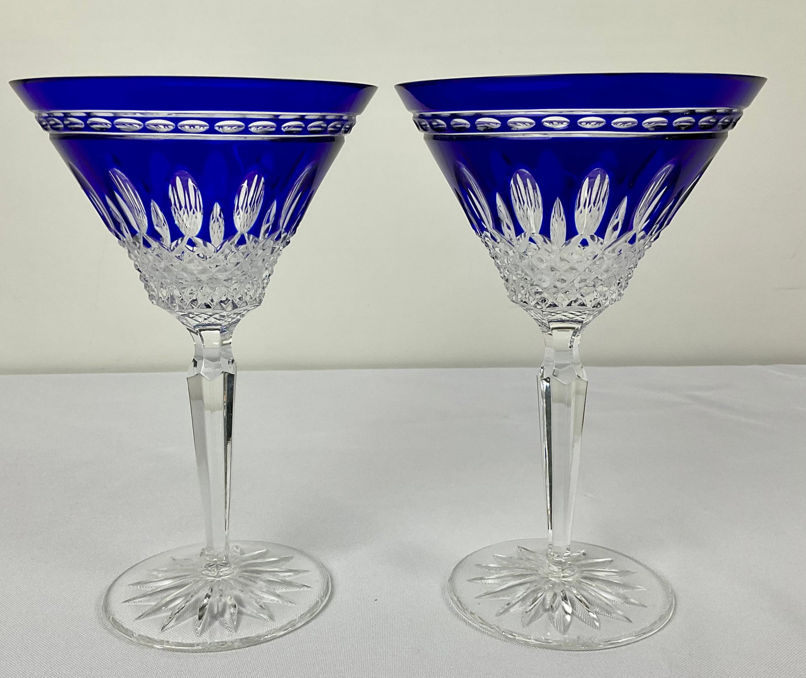 Pair of Waterford Cobalt Blue Clarendon Martini Glasses: Pair of Waterford Cobalt Blue Clarendon Martini Glasses 7" H, signed on bottom Condition, Good, no chips or cracks. See Photographs