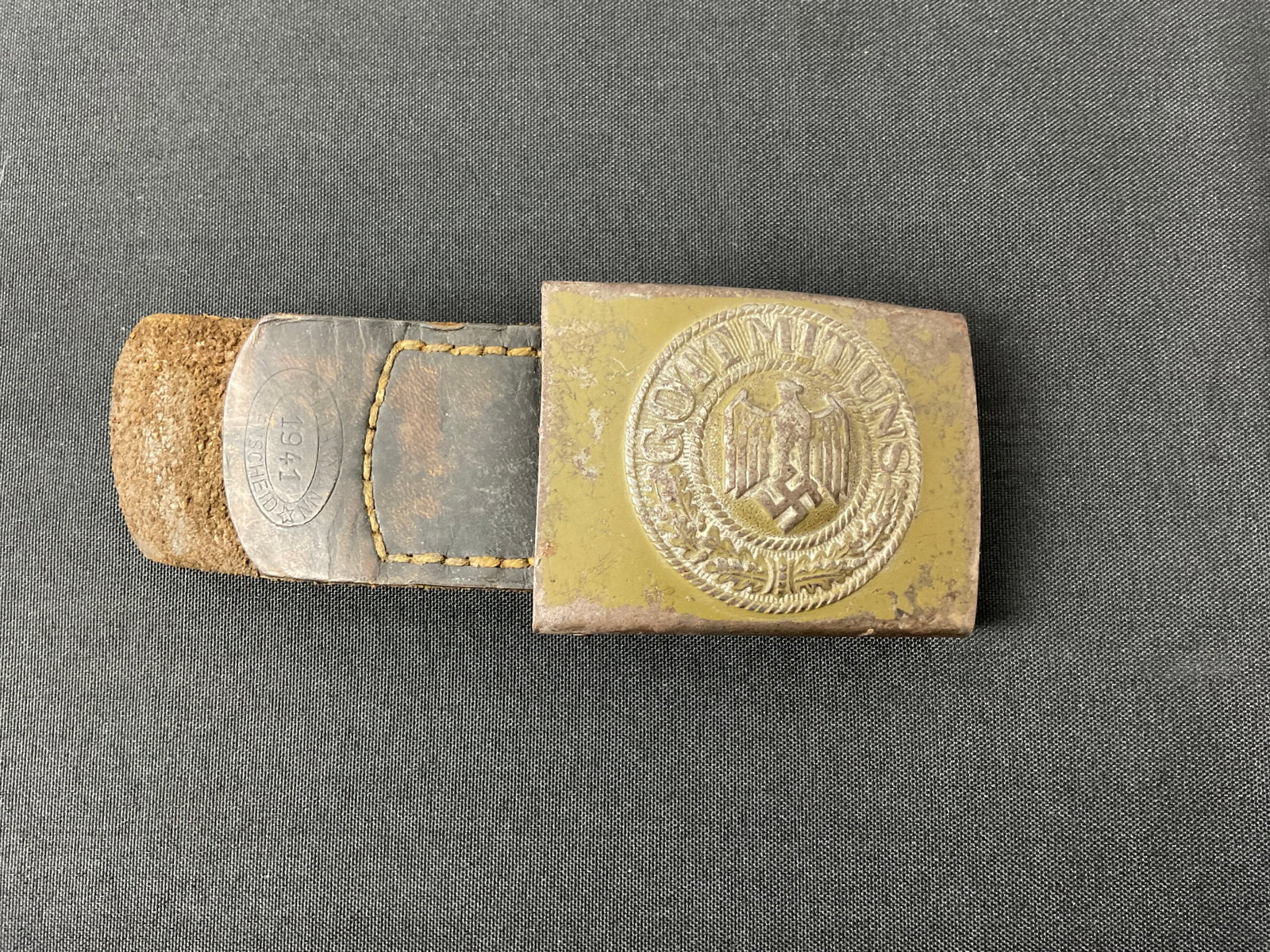 German WW II Army Belt Buckle: German WW II Army Bel Buckle, was painted green dated 1941, stamped with Army eagle and Gott mit uns Buckle 2" X 2.5" X .05" Condition: Worn from age, scratched, and ru