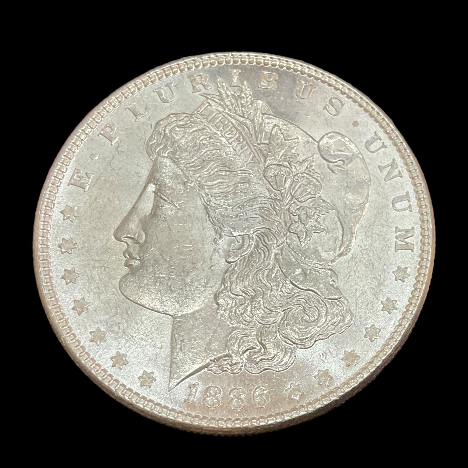 1886 Morgan Silver Dollar, (1 of 2)