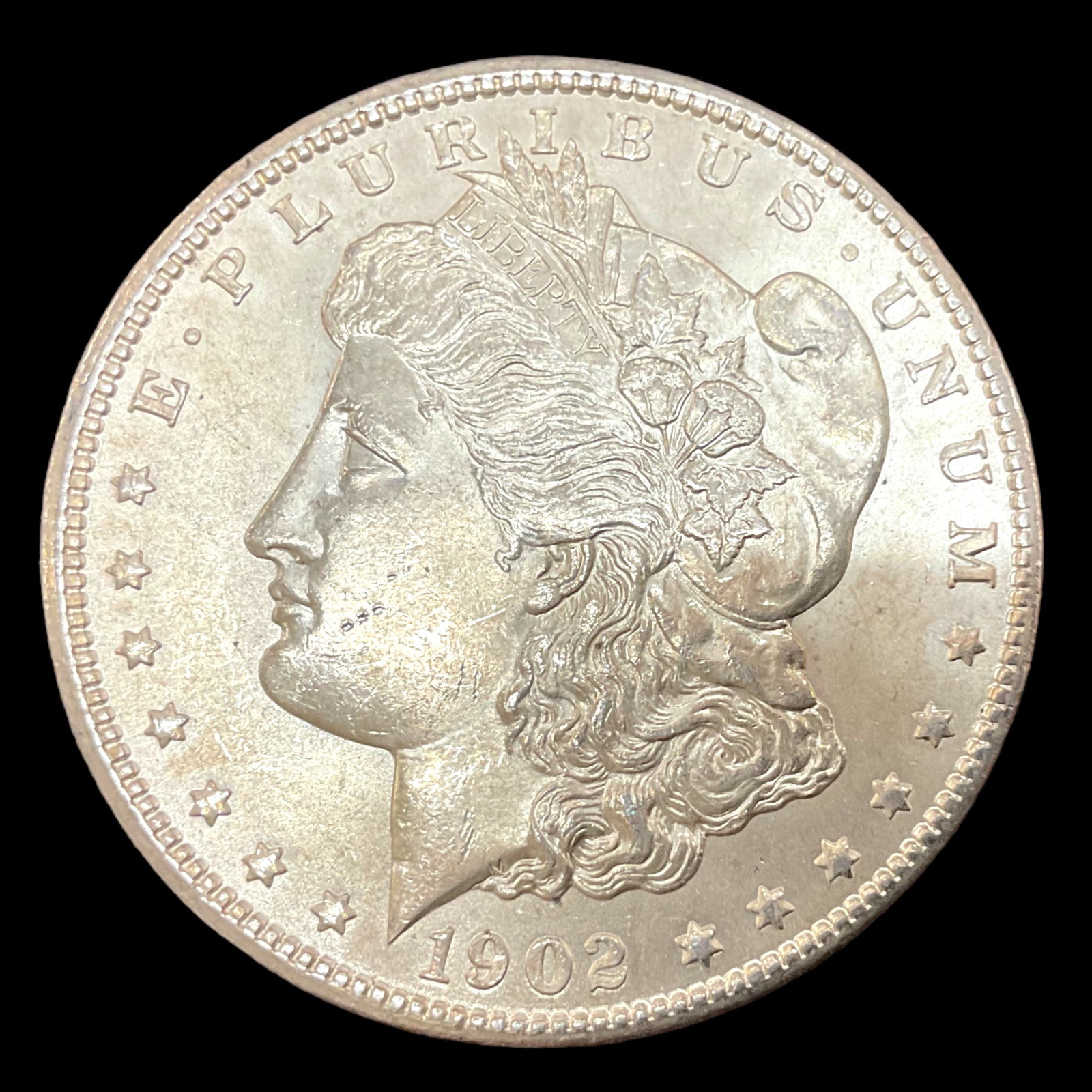 1902 O Morgan Silver Dollar: 1902 O Morgan Silver Dollar, 0.900 Silver, net weight .77344 ozt pure silver, 26.73 g, 38.1 mm diameter, in protective plastic coin holder, Condition, see photographs.