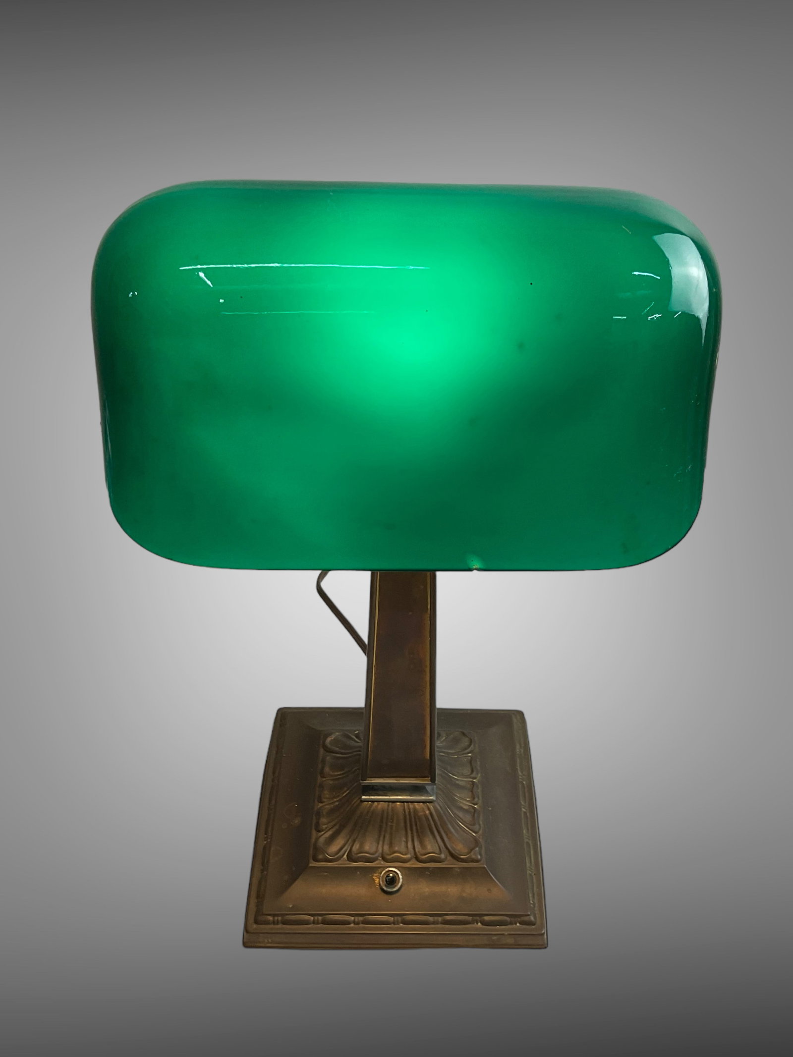 H.G. McFadden & Co. Emeralite Desk Lamp No. 8734: H.G. McFadden & Co. Emeralite Brass Desk Lamp No. 8734, Pat. Aug 15, 1916 with Green Glass Shade. Measures 17 1/2" H, base measures 7" x 7", Condition, good, chip to green shade nea