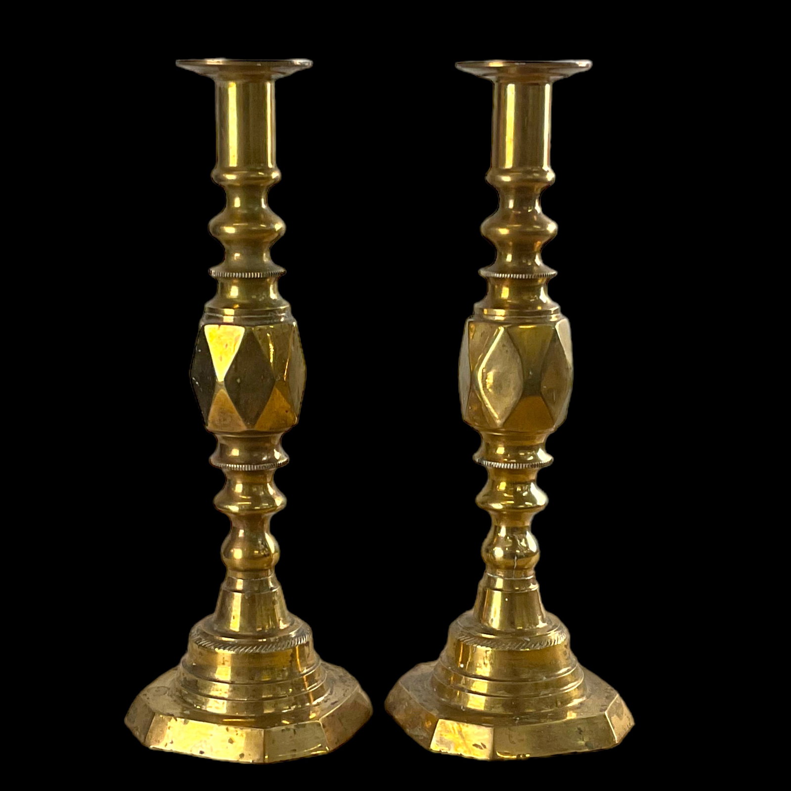 Pair Of Vintage Brass Candle Holders With Diamond Pattern: Pair Of Vintage Brass Candle Holders With Diamond Pattern, measure approximately 11.5 " tall and 4.0" width. Push up rods are missing. Condition, wear consistent with age. There is candle wa