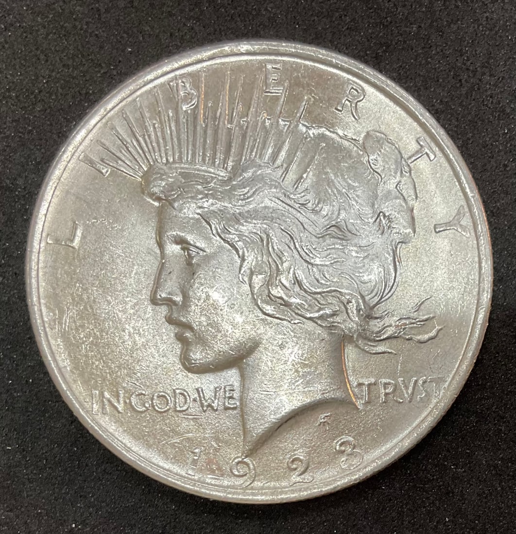 1923 Peace Silver Dollar: 1923 Peace Silver Dollar, in protective coin holder, Condition, see photographs.