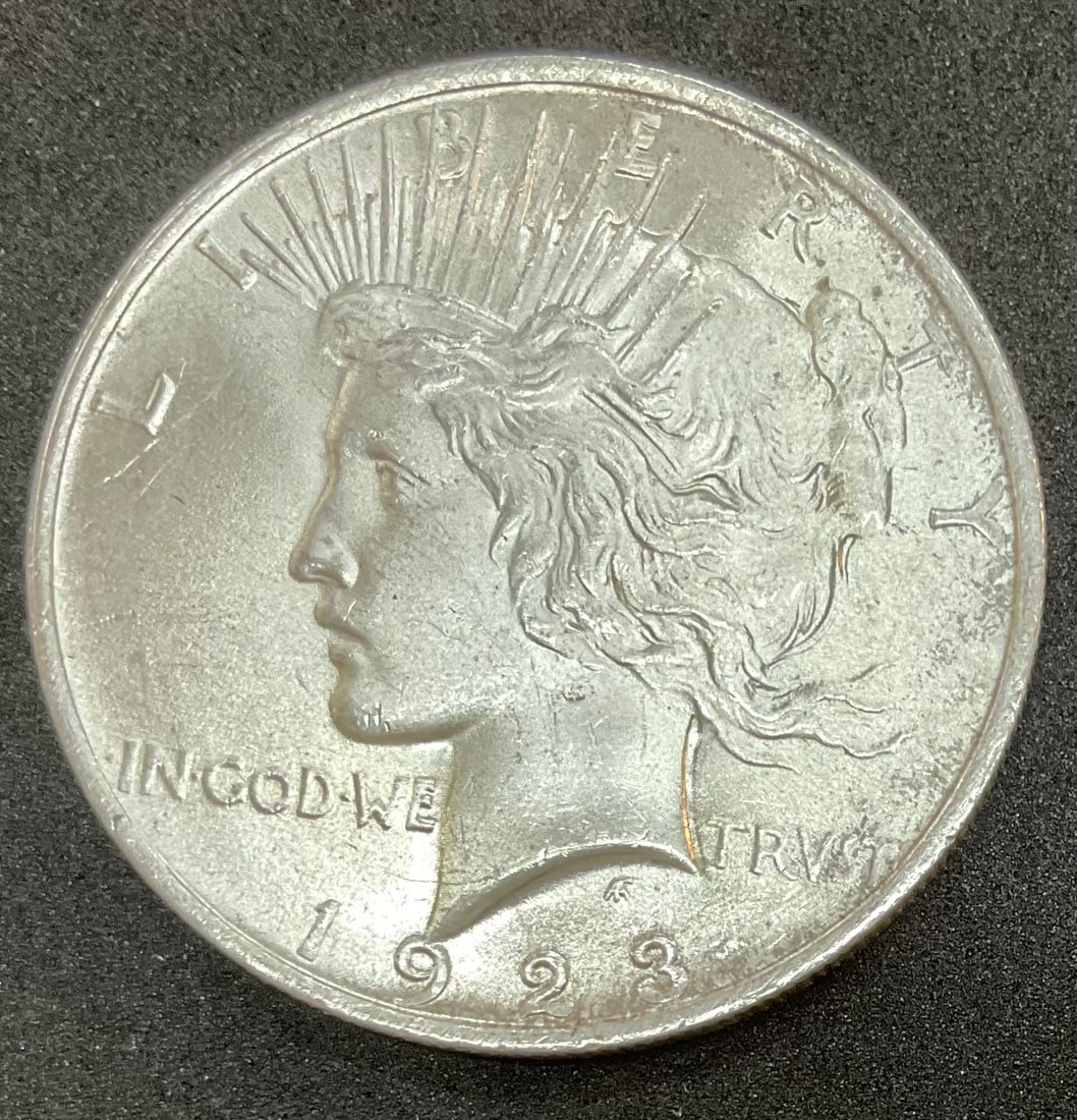 1923 Peace Silver Dollar: 1923 Peace Silver Dollar, with protective coin holder, Condition, see photographs.