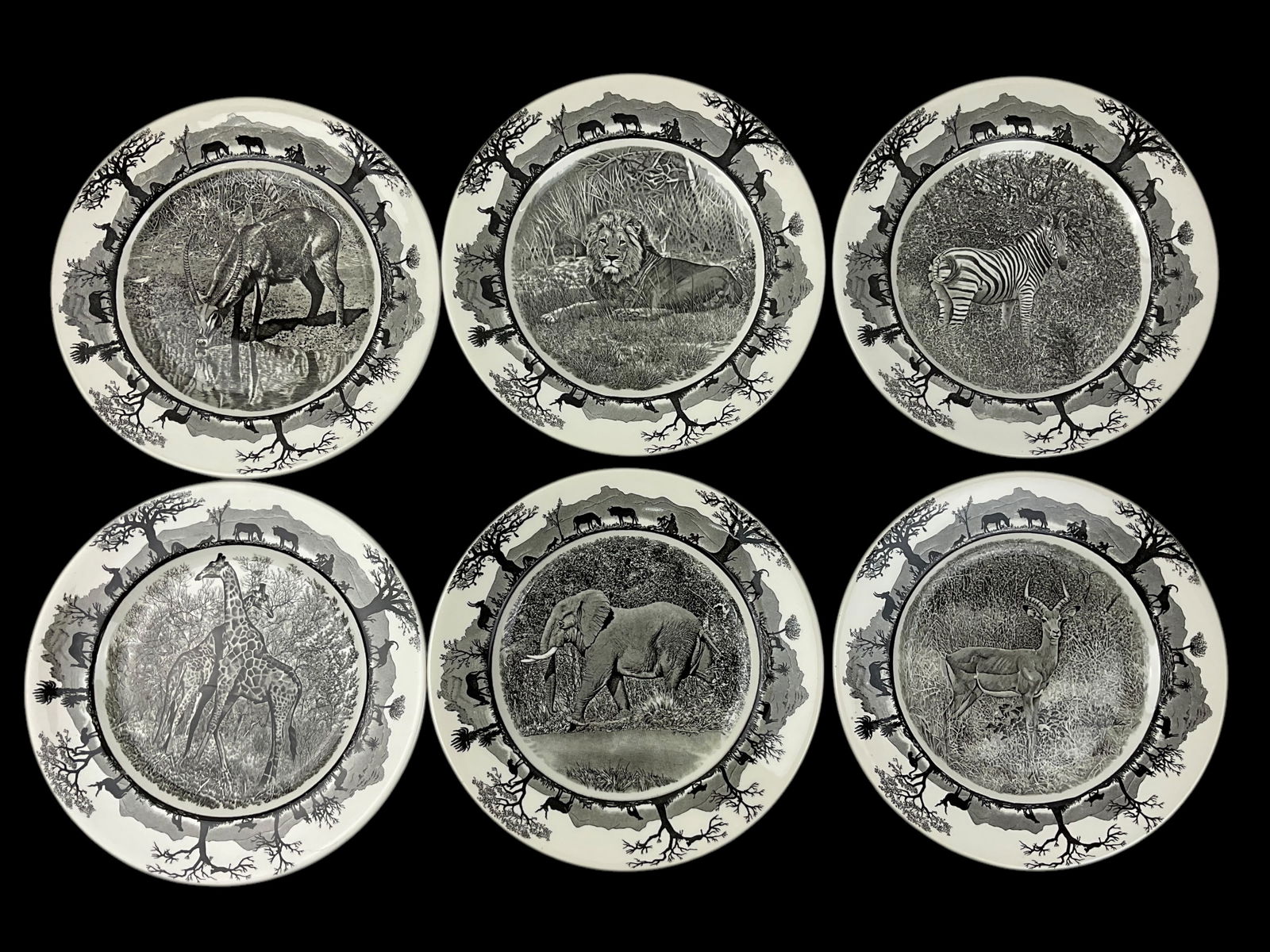 Set of 6 Wedgwood Kruger National Park Animal Plates: Set of 6 Wedgwood Kruger National Park Animal Plates, Plates depict Giraffe, Waterbuck, Elephant, Impala, Lion, and Zebra, Maker’s Mark on bottom of plate, Approximately 8 1/2 “ D, Condtio
