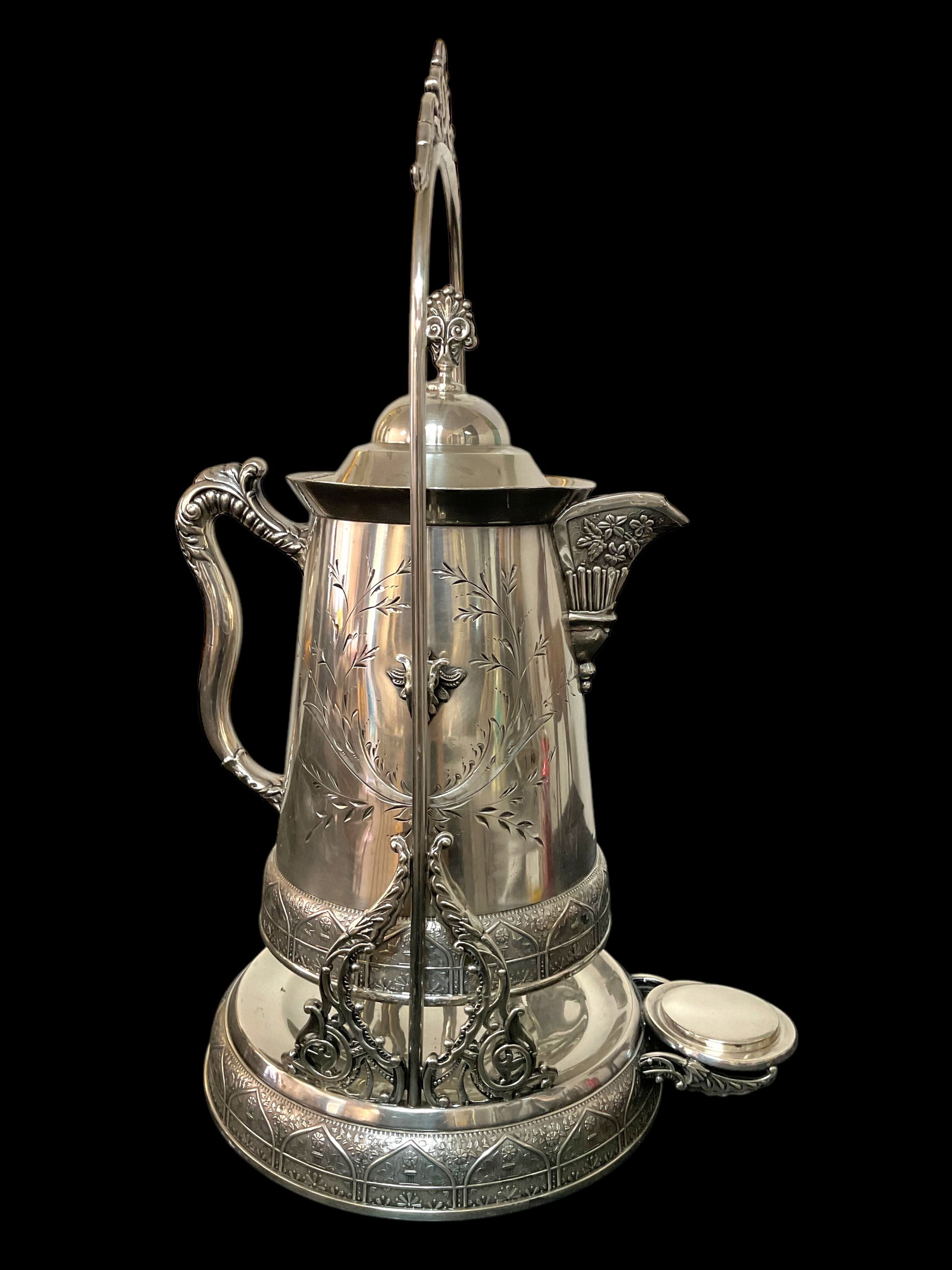 Waldorf Silverplate Tilting Insulated Coffee Pot and Stand: Waldorf Silverplate Tilting Insulated Coffee Pot and Stand, Porcelain pot, measures 19 1/2" H with stand, Condition good, dents to front, see photographs.