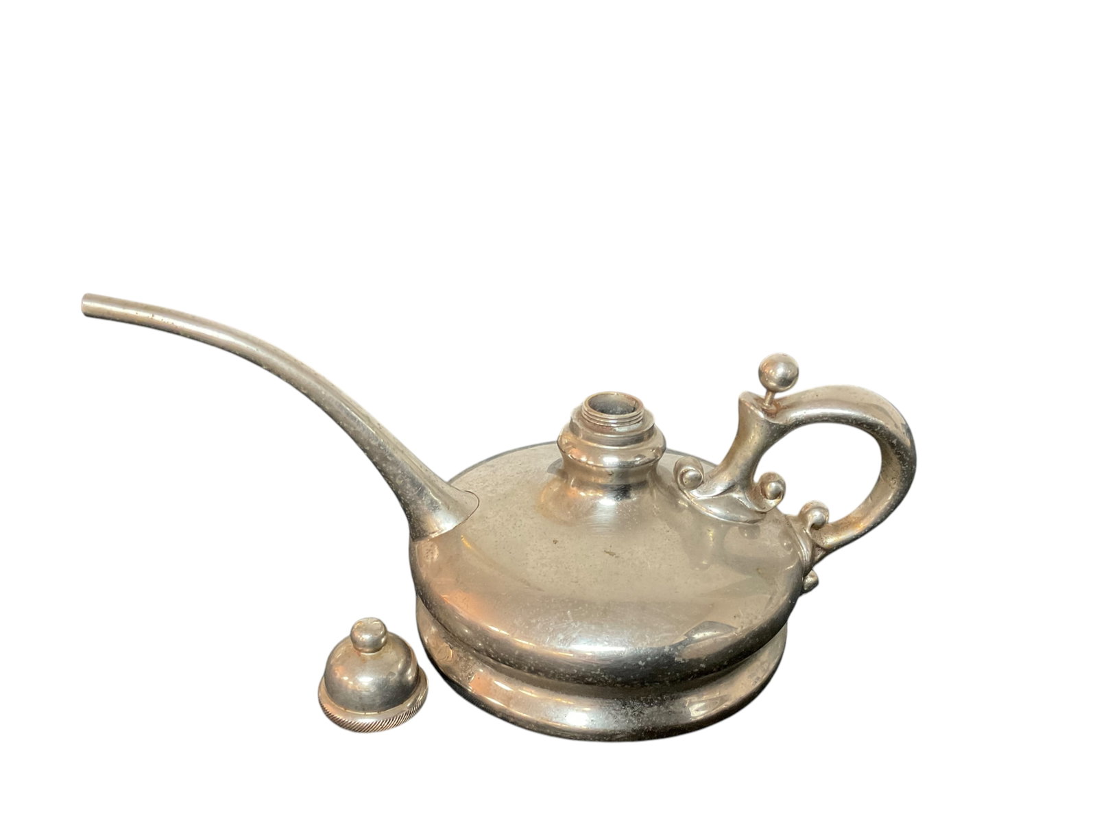 JC Jewett Antique Silver Plate Oiler: JC Jewett Antique Silver Plate Oiler Buffalo, with threaded cap and thumb release valve, measures 3/4" H x 7" L, Condition, see photographs. 