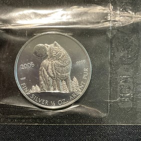 Canada 2006 Elizabeth II Wolf One Dollar .9999 Fine Silver Coin plus Canada 50 Cent Uncirculated