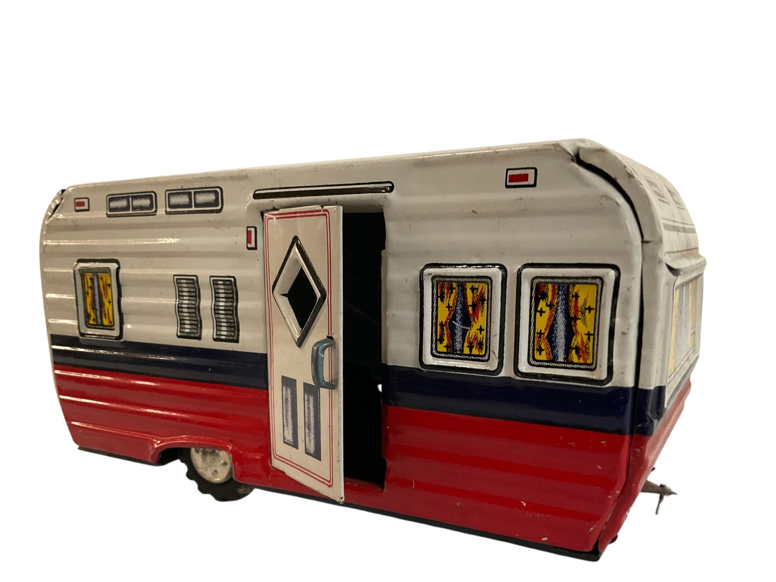 1950's Japan Tin Litho House Travel Trailer: 1950's Japan Tin Litho House Travel Trailer, 3 1/4" tall, 7" wide, 3 1/4" deep, Condition, small dents and scratches, see photographs.