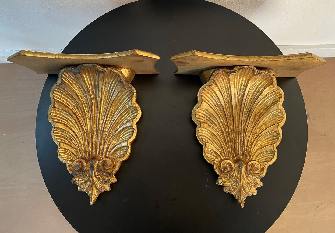Italian Carved Gold Gilt Shelves - Pair: Pair of Italian carved gold gilt shelves. The shelves are of a resin material. Measures: 14H x 14W x 7.25D