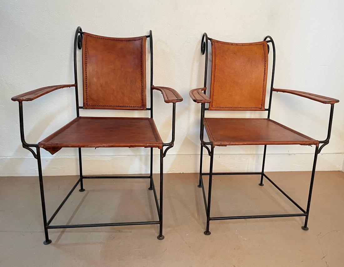 Leather and Wrought Iron Armchairs - Pair: Scrolled top. Wrought iron frames. Measures: 34.5H x 24.75W x 27D. SH17