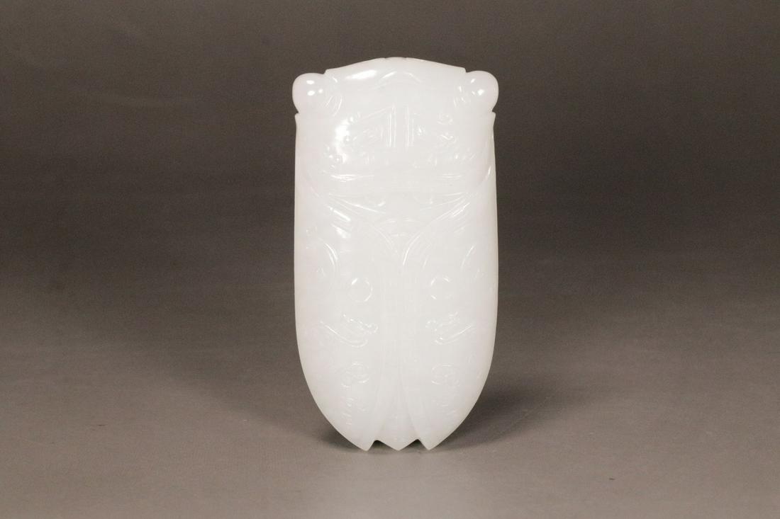 A Hetian Jade 'Animal Mask' Decoration (1 of 9)