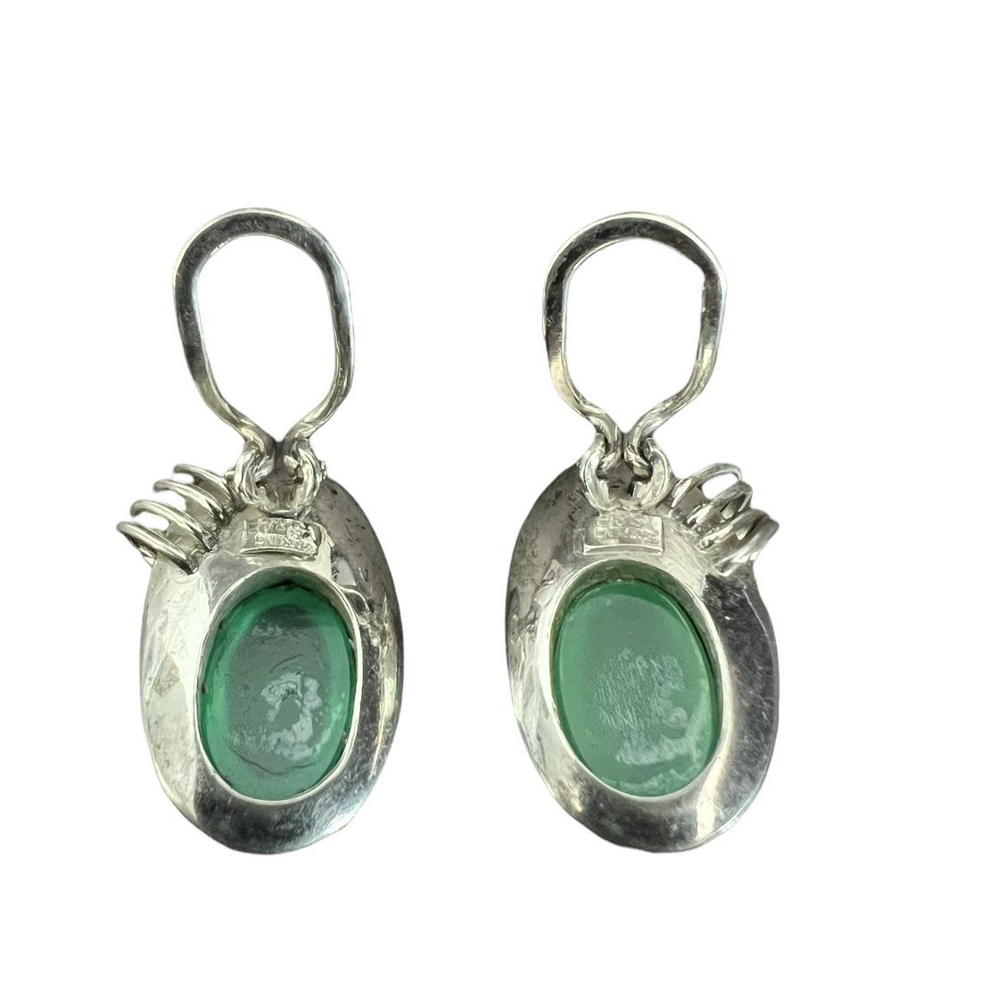 Sterling Silver Green Moonstone Earrings, Mid 20th Century: Sterling Silver Green Moonstone Earrings. Mid 20th Century. Size: 1 in. Weight: 6.10g. Shipping available from Raleigh, NC