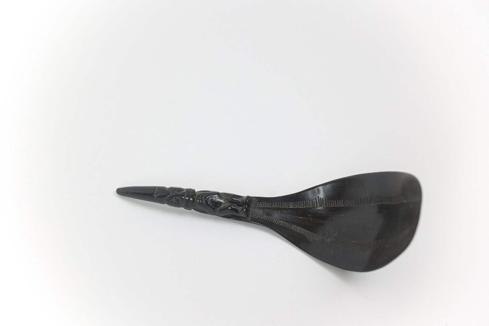Inuit Carved Spoon: Traditional hand carved feast spoon dating to the 20th C and made from horn. Measures 6 3/4" W x 4" H x 2" D