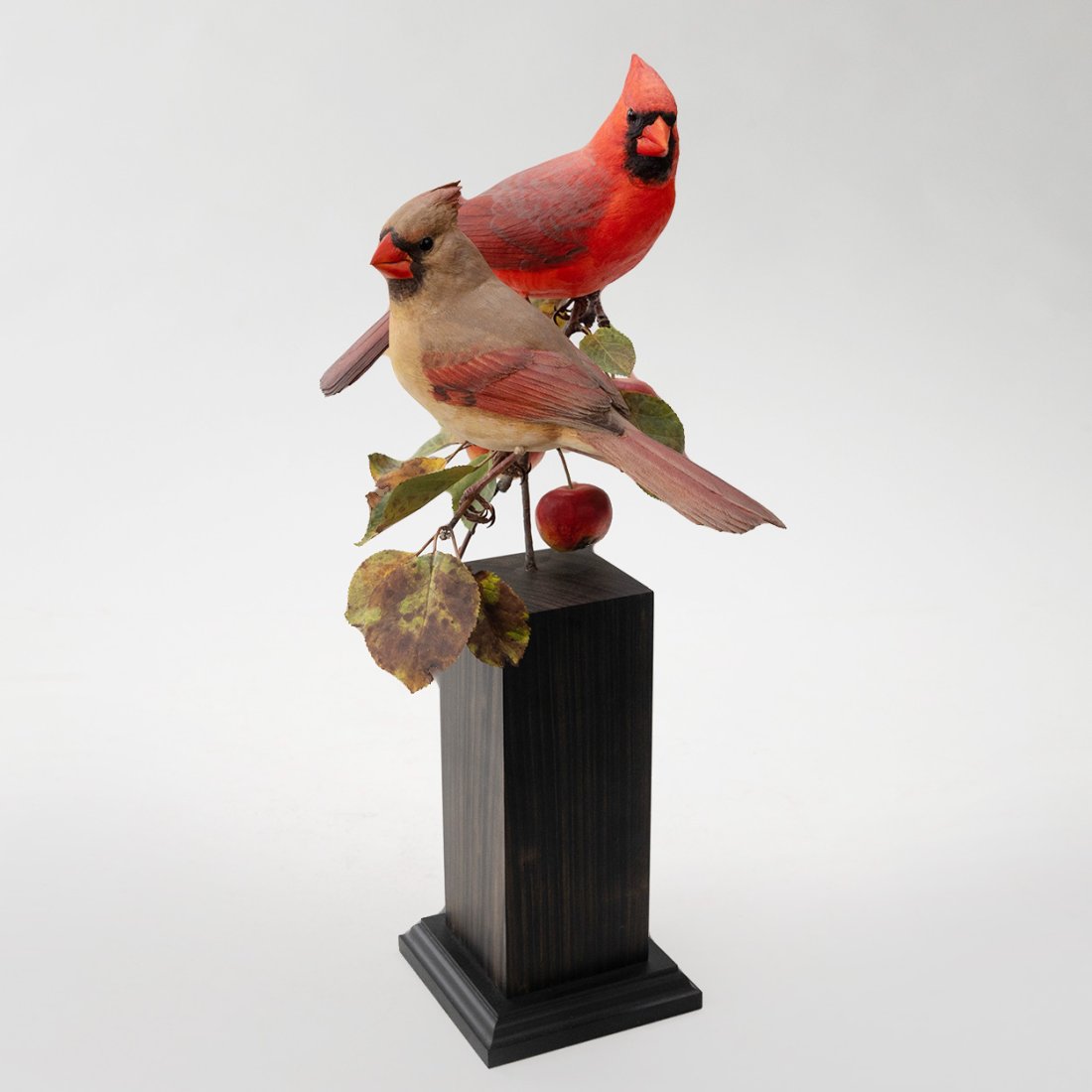 Carved Pair of Red Cardinals on Fruit Branch by Bruce Lepper: Carved Pair of Red Cardinals on Fruit Branch with Metal Painted Leaves by Bruce Lepper dated 2007 measuring 16.5" high