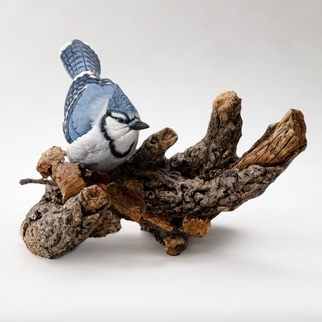 Stoneware Clay Bluejay Sculpture by Paul Brunelle: Stoneware Clay Bluejay Sculpture by Paul Brunelle measuring 10" wide x 9" high x 6.5" deep Paul Brunell sculptures are created from stoneware clay, once complete it is fired in a kiln to a high bisque