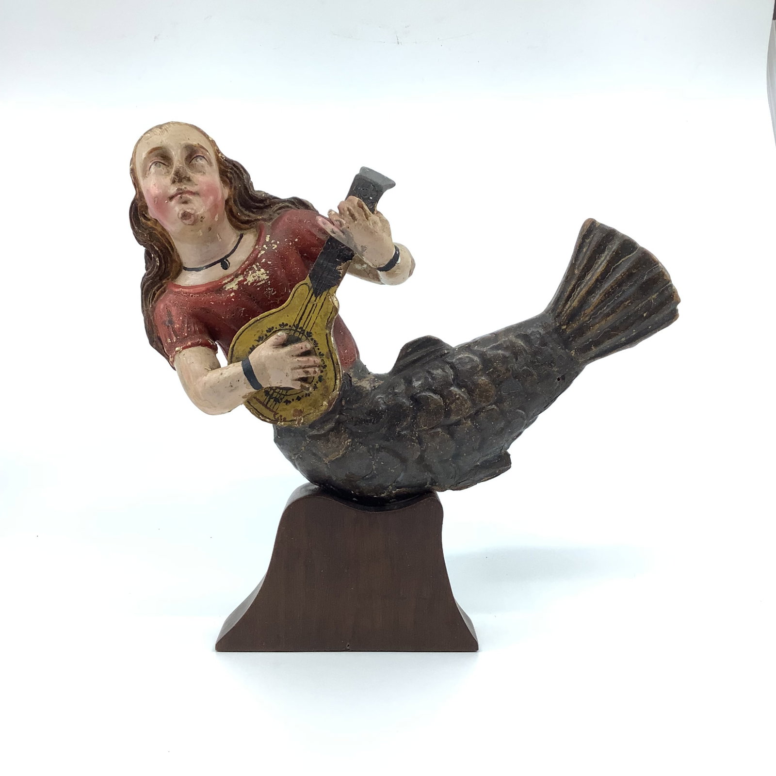 Continental Carved Polychromed Wooden Mermaid on Stand: Wooden Mermaid on custom base stand, depicts girl playing lute. Figure has chipped paint frew breaks and crack on the tail Measuring 7" high x 10" wide height on base is 9.75" high