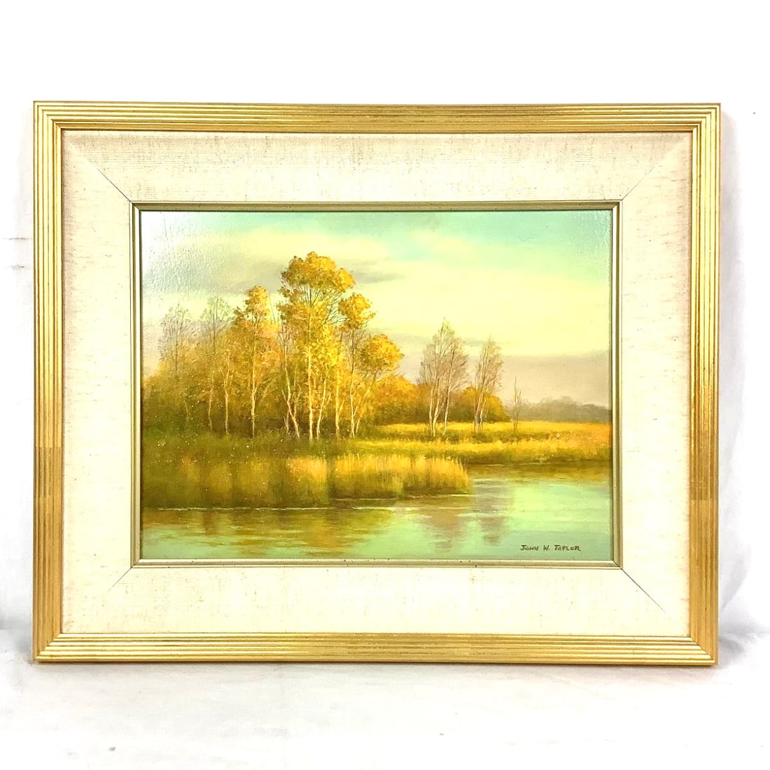 Original Oil Landscape Painting by John W. Taylor (1931-2017): this original oil painting on board titled "October Light" signed in lower right corner by John Williams Taylor. His artwork was on exhibit with Troika Gallery Easton, MD. 21601 frame measurements are
