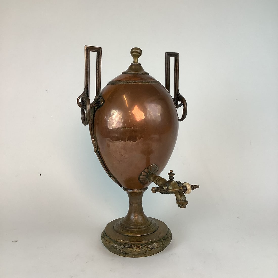 Copper And Brass Samavour: Brass base and decor with ringsSmall dent on the backSpout sticks out (5.5")Measures: 18.5" high x 11.5" wide