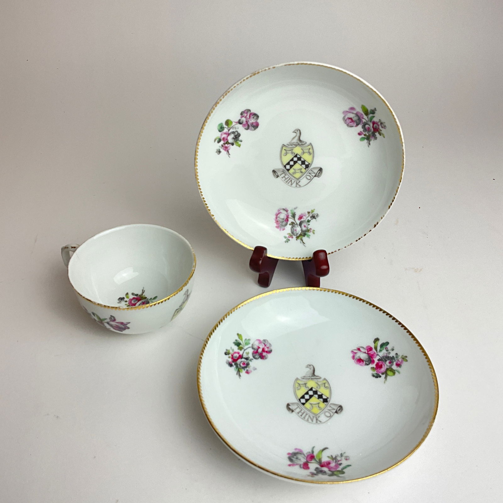 Chinese Export Armorial Hand-Painted Porcelain: Two bowls, one tea cup. One bowl has a crack across entire bowl. Bowls:5" diameter. Tea cup: 1.75" high x 3" diameter