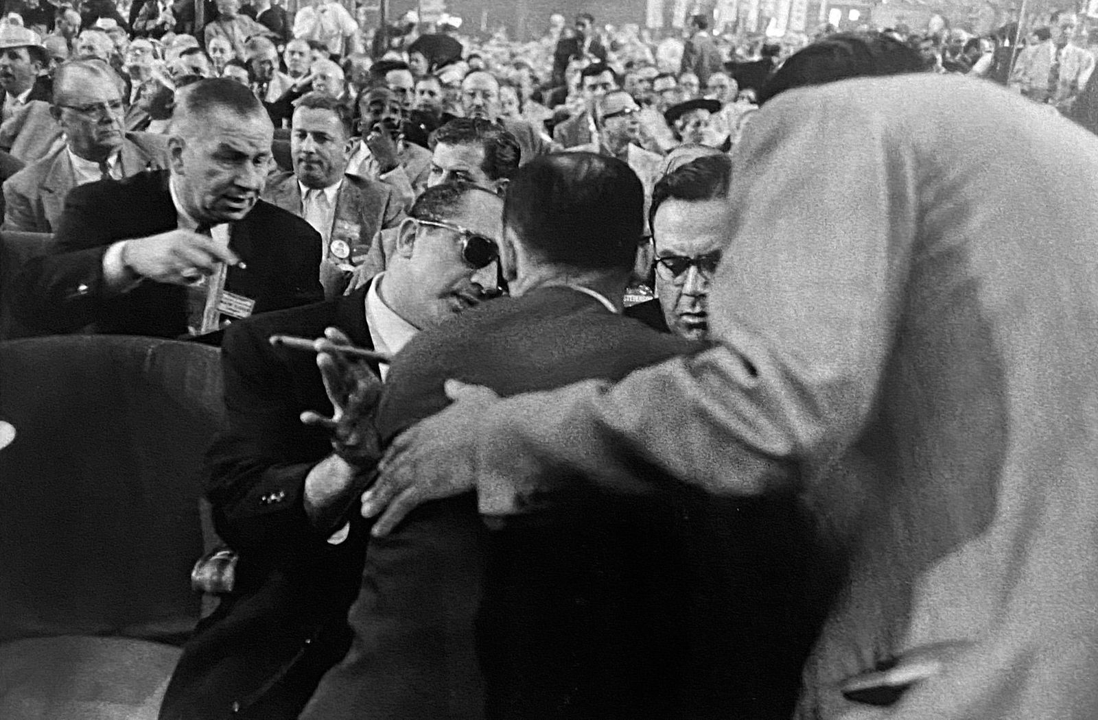 Robert Franks, Convention Hall- Chicago: Photographer: Robert Frank (1924-2019) was a Swiss photographer and documentary filmmaker, who became an American binational. His most notable work, the 1958 book titled The Americans, earned Frank co