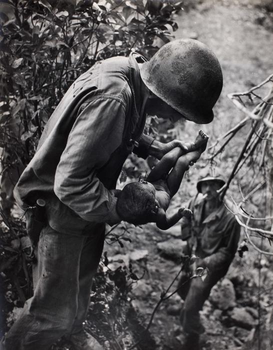 W. Eugene Smith, Saipan (Soldier Holding Baby), 1944: Photographer: Vivian Dorothy Maier, (1918-1978) William Eugene Smith was an American photojournalist. He has been described as "perhaps the single most important American photographer in the deve